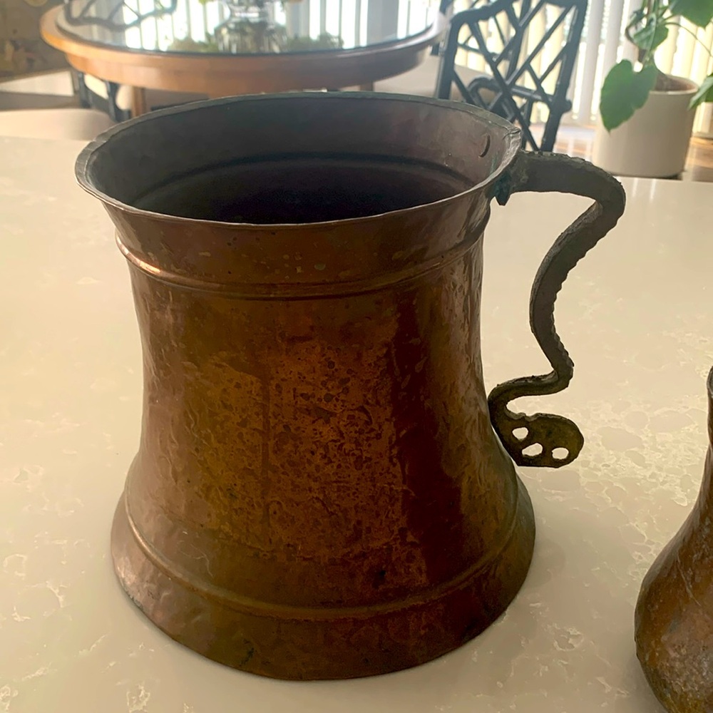 Two copper pitchers